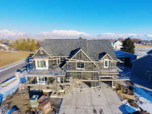 Rear view of property featuring a mountain view