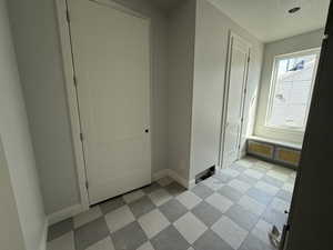 Interior space with baseboards and a textured ceiling
