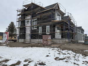 View of snow covered property