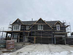 Unfinished property with a garage