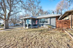 View of front of property with a front lawn