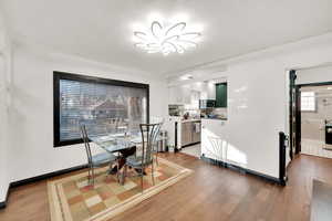 Dining space featuring hardwood / wood-style flooring