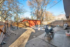 View of yard featuring a patio and a mountain view