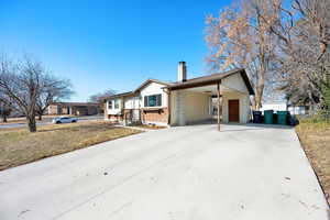 View of front facade featuring a carport