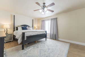 Bedroom featuring hardwood / wood-style flooring and ceiling fan