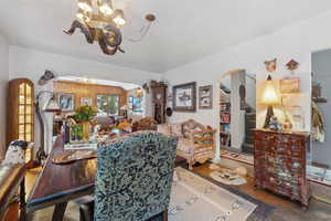 Dining room featuring hardwood / wood-style flooring and a chandelier