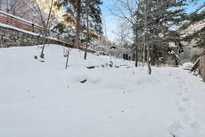 View of yard layered in snow