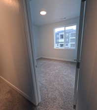 Spare room with carpet floors