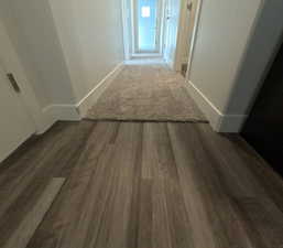 Corridor featuring dark hardwood / wood-style flooring