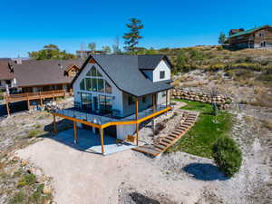 front of house featuring a partially covered deck.