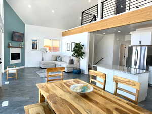 Dining area with high vaulted ceilings