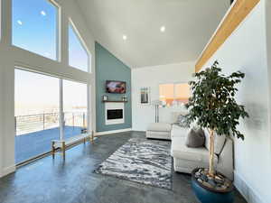 Living room with a high vaulted ceiling