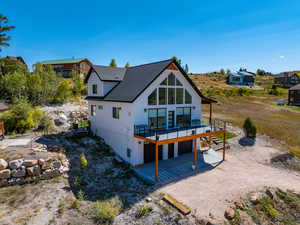 View of house featuring a deck