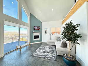 Living room featuring a vaulted ceiling and fireplace