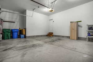 Garage featuring a garage door opener