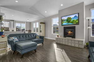 Windows all around the family and kitchen -Living room with vaulted ceiling and LVP/ wood-style floors Fire place