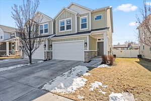 View of front facade featuring a garage