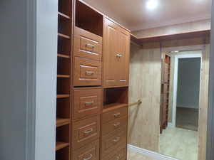 Owners Spacious Walk-In Closet with Custom Built Closets