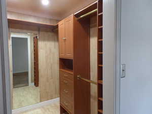 Owners Spacious Walk-In Closet with Custom Built-Ins