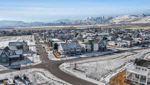 Snowy aerial view featuring a mountain view