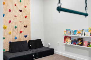 Bedroom/playroom featuring carpet