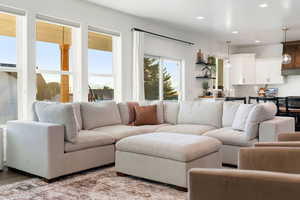 Living room with hardwood / wood-style flooring and sink