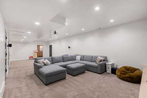 Living room featuring light colored carpet