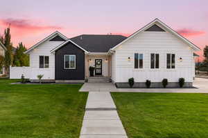 View of front of property featuring a yard