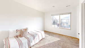 View of carpeted bedroom