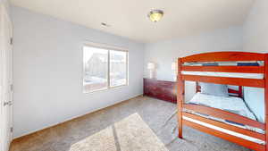 View of carpeted bedroom