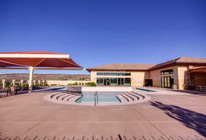 View of community pool with a patio area