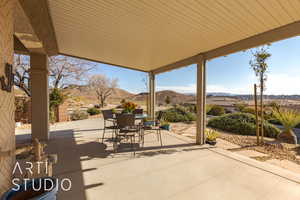 View of patio / terrace featuring a mountain and golf course view