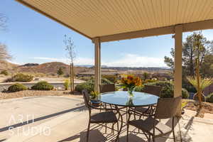 View of patio / terrace with a mountain and golf course view