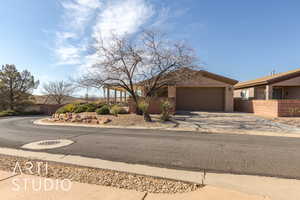 View of back of property with a garage