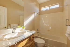 Hall (2nd) bathroom with tub / shower combination, vanity, and toilet