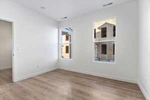 Empty room featuring light hardwood / wood-style floors