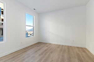 Spare room featuring light hardwood / wood-style flooring