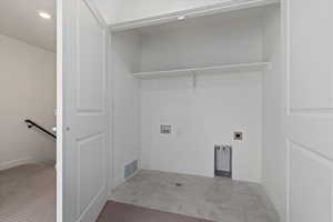 Laundry area featuring washer hookup, light tile patterned floors, and electric dryer hookup