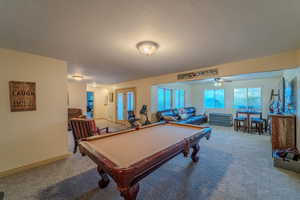 Game room with billiards and carpet floors