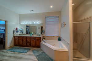 Bathroom with vanity and independent shower and bath