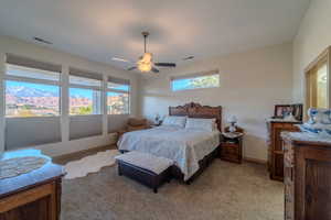 Bedroom featuring light carpet and ceiling fan