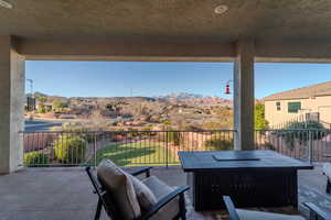 View of patio / terrace featuring a balcony and a mountain view