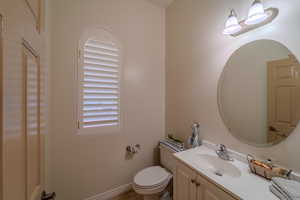 Bathroom featuring vanity and toilet