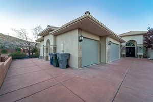 View of side of home featuring a garage