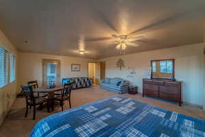 Bedroom featuring carpet flooring and ceiling fan