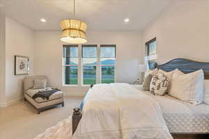 Carpeted bedroom featuring a mountain view