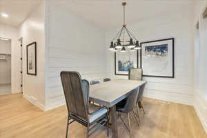 Dining area with light hardwood / wood-style floors