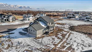 Snowy aerial view featuring a mountain view