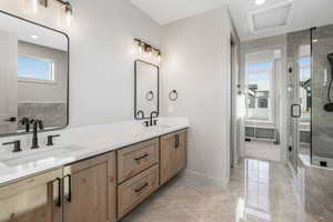 Bathroom featuring vanity and walk in shower