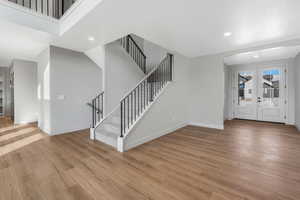 Foyer featuring french doors and light wood-type flooring